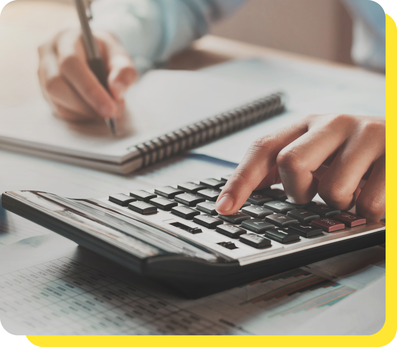 Hand on Calculator Preparing Budget Calculation