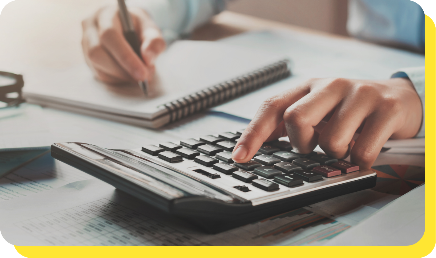 Hand on Calculator Preparing Budget Calculation