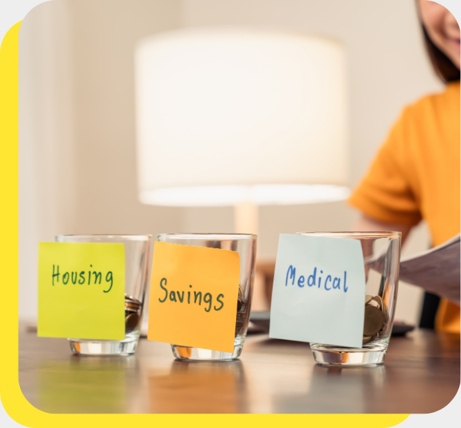 Woman smiling with budgeting jars in front of her, showcasing the practical use of a budget calculator.