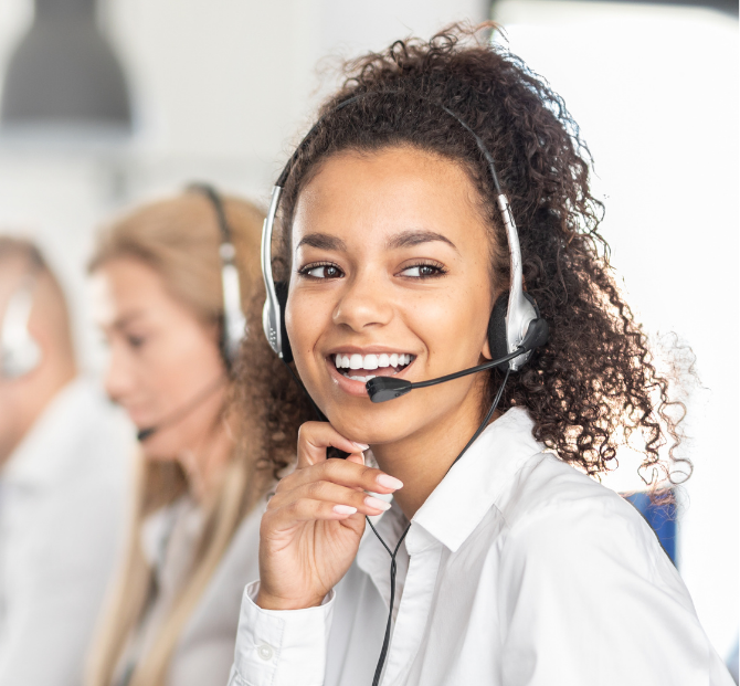 Woman on the phone providing friendly customer support about personal loans, encouraging borrowers to call Serve and Protect Credit Union with questions or concerns, and linking to the contact us page.