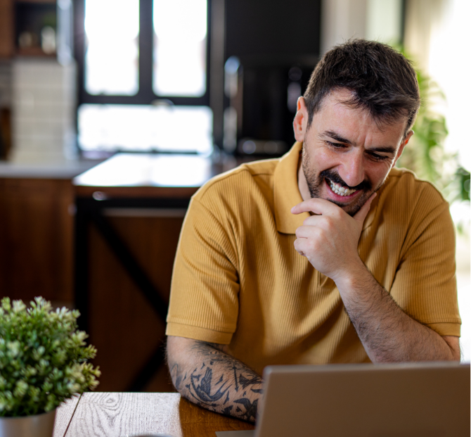 A happy man smiling looking at payroll loans with Serve and Protect.