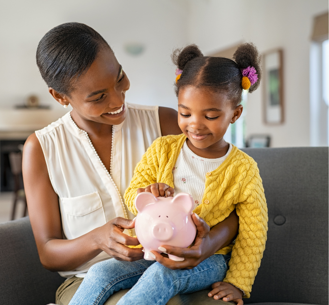 Mum and child smiling with piggy bank while planning savings goals