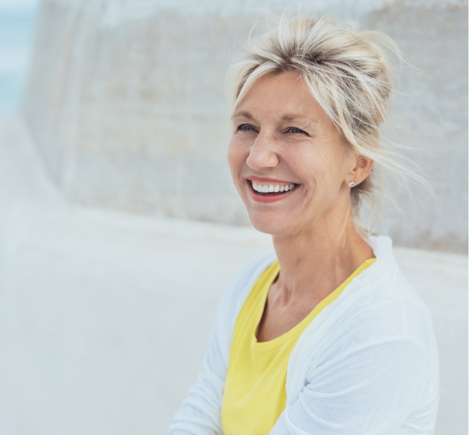 Woman smiling confidently, showcasing the advantages of a Fixed Cash ISA.