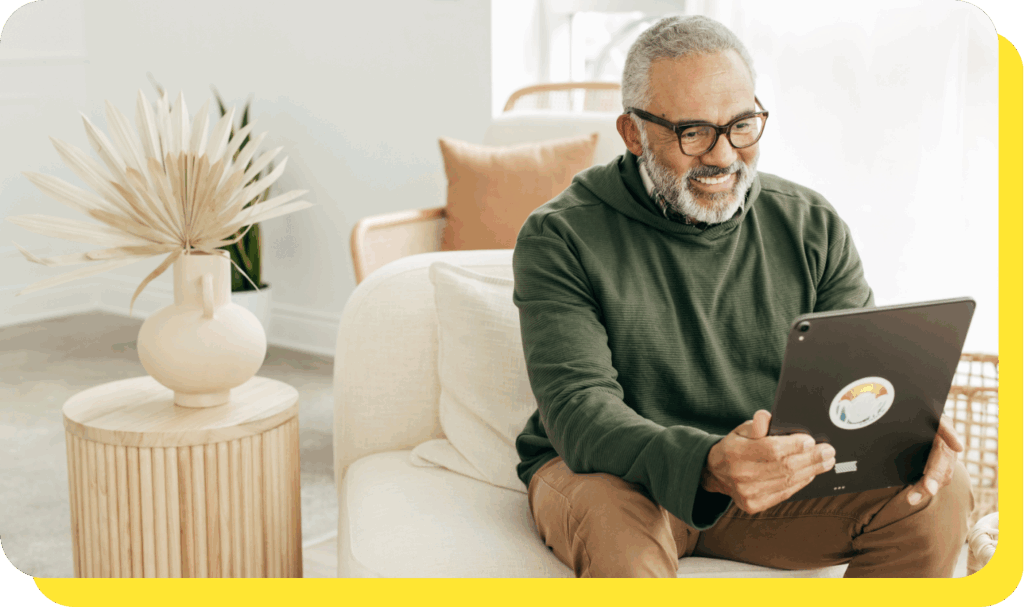 A man on a tablet calculating tax benefits for employees using a benefits calculator