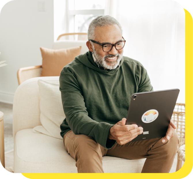 A man on a tablet calculating tax benefits for employees using a benefits calculator