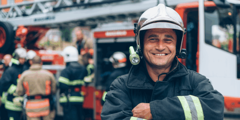 Firefighter with arms crossed and smiling
