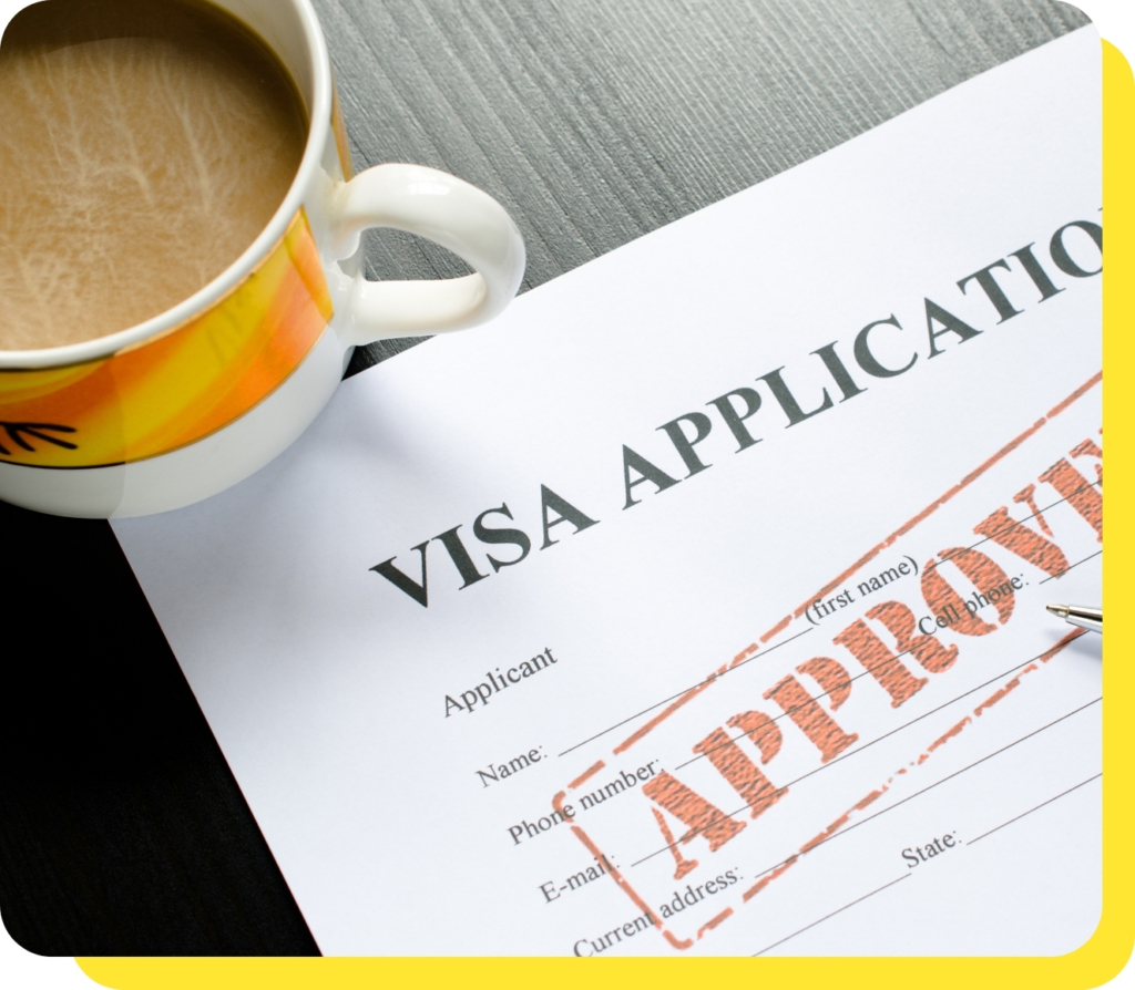 A close-up of a mug placed next to an approved visa application, symbolising the ease and support provided by Serve and Protect's visa loans.