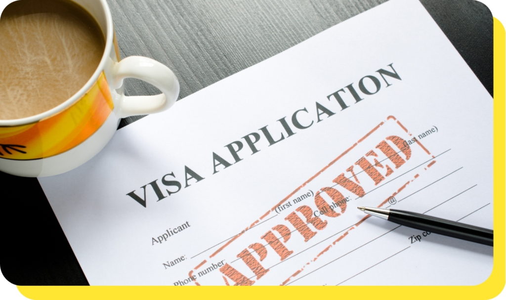 A close-up of a mug placed next to an approved visa application, symbolising the ease and support provided by Serve and Protect's visa loans.