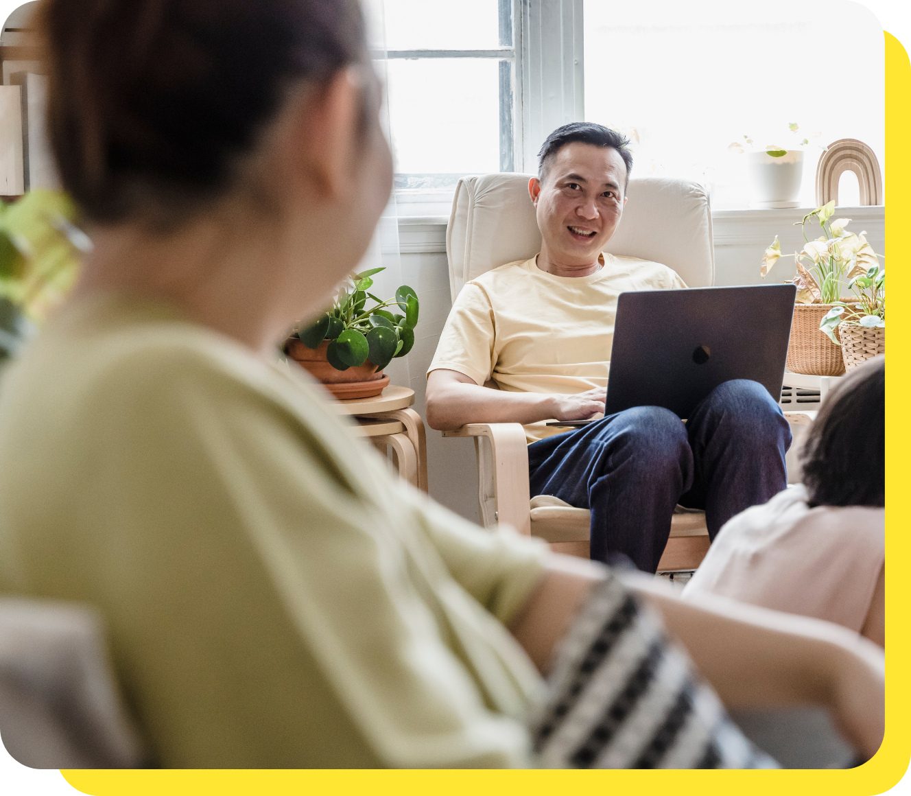 Smiling couple discussing tax benefits for employees, representing financial satisfaction and partnership support from their credit union