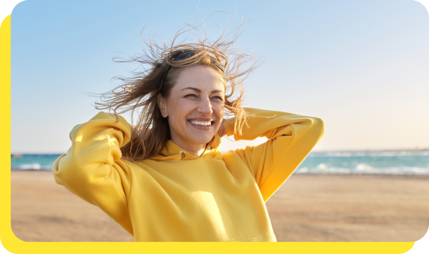 Woman looking relieved after using benefits calculator to discover tax benefits for employees available through her credit union