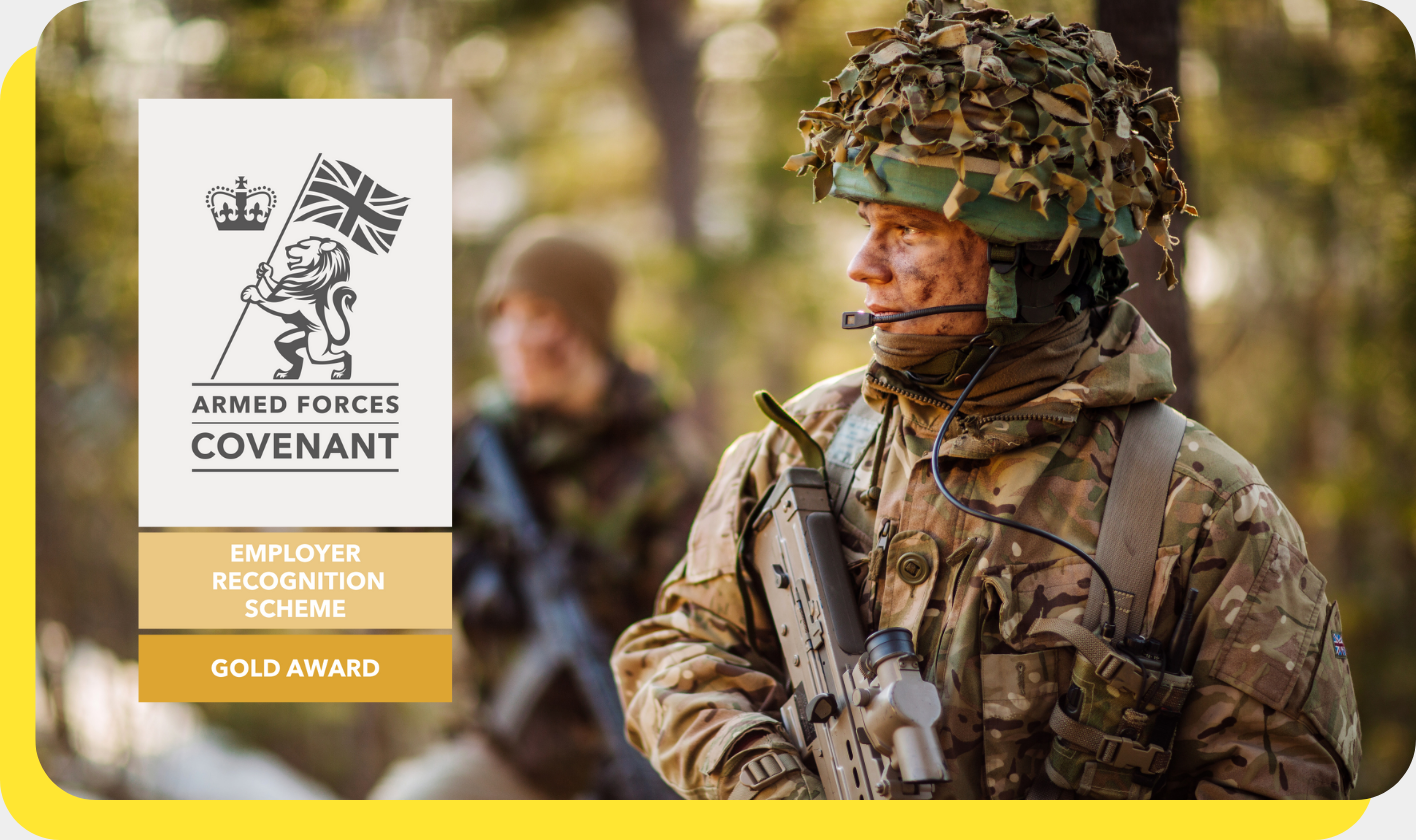 A proud soldier in uniform standing confidently with the Armed Forces Covenant Gold Award logo, representing the company's commitment as an armed forces-friendly employer.