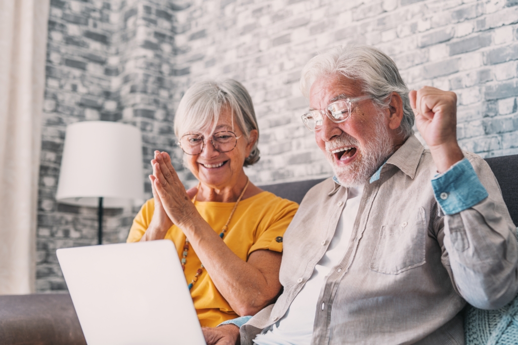 Couple celebrating after seeing their credit union lottery win