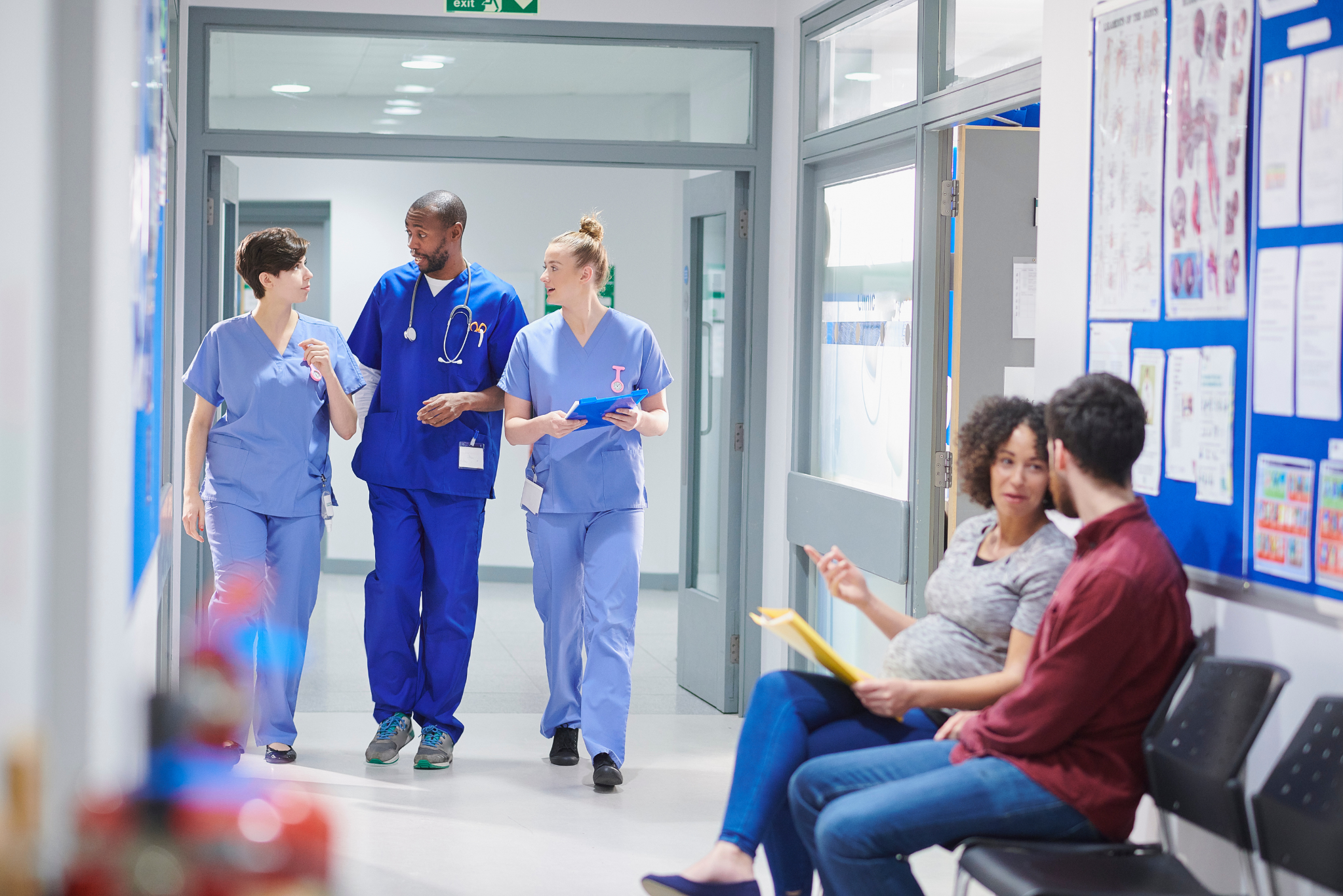 NHS staff members discussing workplace benefits and NHS staff perks while walking