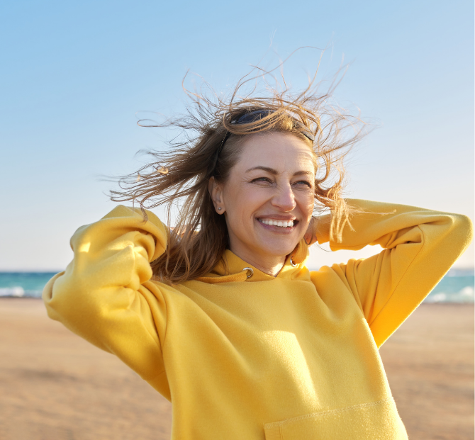 Smiling after reviewing tax benefits for employees