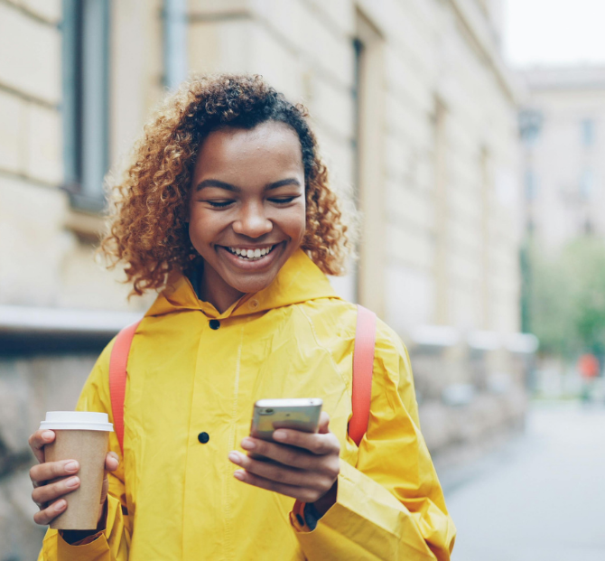 Woman using phone to calculate early loan repayment savings